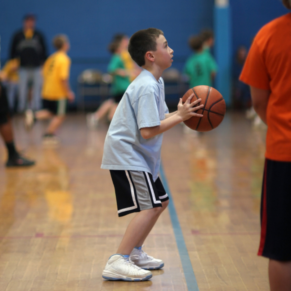 Kids gets ready to shoot basketball A kid gets ready to shoot a basketball